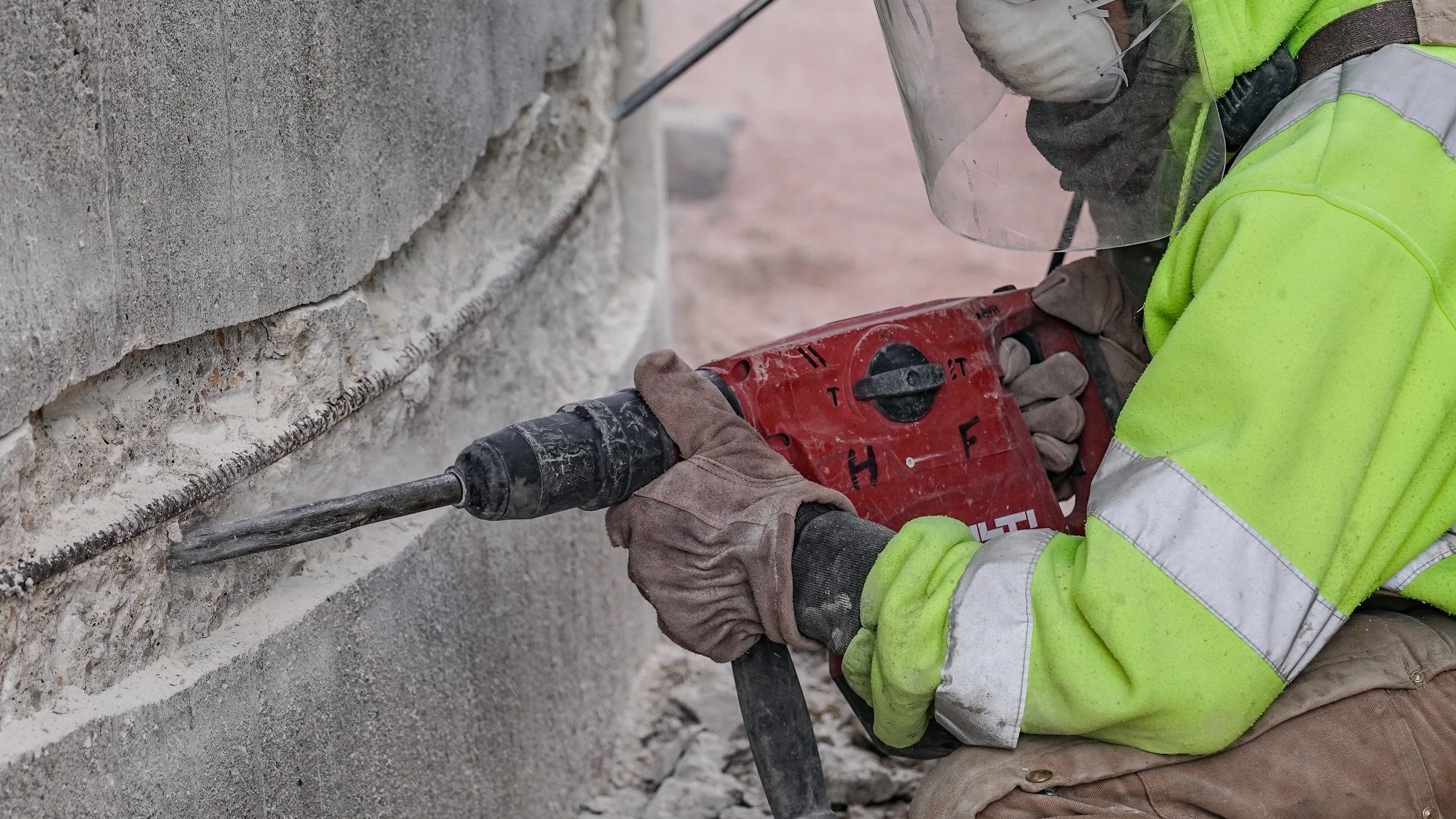 Professional concrete repair work showing crack sealing and restoration